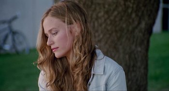 Movie still from “Boyhood” (2014), directed by Richard Linklater – A woman with long hair is looking down; Close Up shot, Low angle