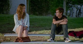 Movie still from “Boyhood” (2014), directed by Richard Linklater – A man and a woman sitting on a bench; Medium shot, Over the shoulder angle