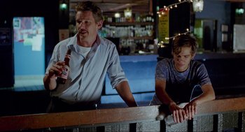 Movie still from “Boyhood” (2014), directed by Richard Linklater – A man and a woman sitting at a bar; Medium shot, Over the shoulder angle