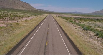 Movie still from “Boyhood” (2014), directed by Richard Linklater – An empty road in the middle of the desert; Extreme Wide shot, High angle