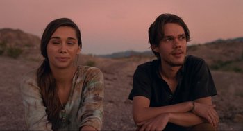 Movie still from “Boyhood” (2014), directed by Richard Linklater – A man and a woman sitting next to each other on the ground; Close Up shot, Over the shoulder angle
