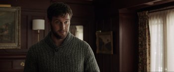 Movie still from “Brahms: The Boy II” (2020), directed by William Brent Bell – A person wearing a sweater in a room; Close Up shot, Over the shoulder angle