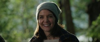 Movie still from “Brahms: The Boy II” (2020), directed by William Brent Bell – A woman wearing a hat smiling for the camera; Close Up shot, Over the shoulder angle