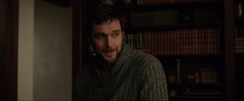 Movie still from “Brahms: The Boy II” (2020), directed by William Brent Bell – A person wearing a sweater; Close Up shot, Over the shoulder angle