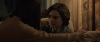 Movie still from “Brahms: The Boy II” (2020), directed by William Brent Bell – A young boy sitting in front of a mirror; Close Up shot, Over the shoulder angle