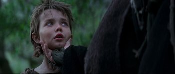 Movie still from “Braveheart” (1995), directed by Mel Gibson – A young boy looking up into the sky; Close Up shot, Over the shoulder angle