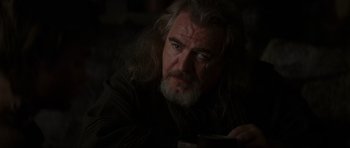 Movie still from “Braveheart” (1995), directed by Mel Gibson – A man with long white hair and a gray beard; Close Up shot, Over the shoulder angle