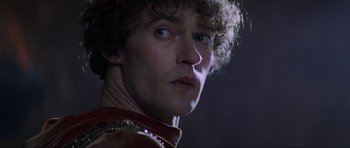 Movie still from “Braveheart” (1995), directed by Mel Gibson – A person wearing a red shirt; Close Up shot, Low angle