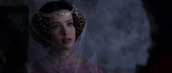 Movie still from “Braveheart” (1995), directed by Mel Gibson – A woman wearing a crown and veil in a dark room; Close Up shot, Over the shoulder angle