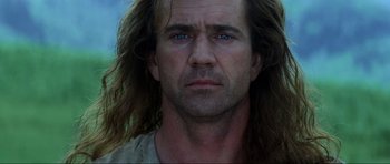 Movie still from “Braveheart” (1995), directed by Mel Gibson – A person with long hair; Close Up shot, Low angle