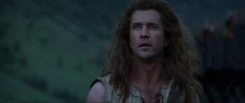 Movie still from “Braveheart” (1995), directed by Mel Gibson – A person with long hair; Close Up shot, Low angle