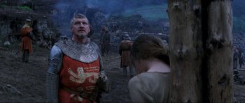 Movie still from “Braveheart” (1995), directed by Mel Gibson – A man and a woman dressed in medieval garb; Medium shot, Low angle