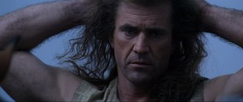 Movie still from “Braveheart” (1995), directed by Mel Gibson – A person with long hair; Close Up shot, Low angle