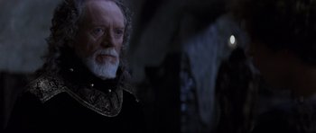 Movie still from “Braveheart” (1995), directed by Mel Gibson – An old man with white hair and a long beard; Close Up shot, Low angle