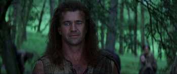 Movie still from “Braveheart” (1995), directed by Mel Gibson – A person with long hair; Close Up shot, Low angle
