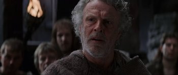 Movie still from “Braveheart” (1995), directed by Mel Gibson – An old man with a beard and a white beard; Close Up shot, Low angle