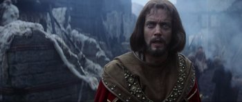Movie still from “Braveheart” (1995), directed by Mel Gibson – A person with a beard wearing a costume; Close Up shot, Low angle