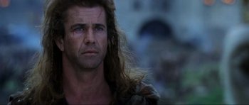 Movie still from “Braveheart” (1995), directed by Mel Gibson – A person with long hair; Close Up shot, Low angle