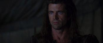 Movie still from “Braveheart” (1995), directed by Mel Gibson – A person with long hair; Close Up shot, Over the shoulder angle
