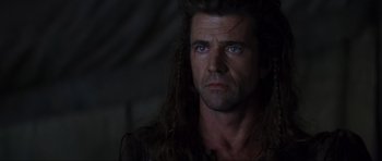 Movie still from “Braveheart” (1995), directed by Mel Gibson – A person with long hair; Close Up shot, Over the shoulder angle