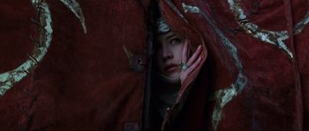 Movie still from “Braveheart” (1995), directed by Mel Gibson – A woman is hiding her face behind a red cloth; Close Up shot, Overhead angle
