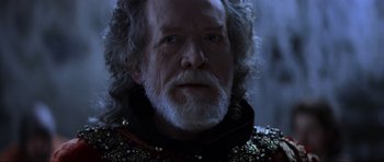 Movie still from “Braveheart” (1995), directed by Mel Gibson – An old man with a beard and a long white beard; Close Up shot, Over the shoulder angle