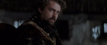 Movie still from “Braveheart” (1995), directed by Mel Gibson – A person with a beard; Close Up shot, Over the shoulder angle