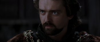 Movie still from “Braveheart” (1995), directed by Mel Gibson – A person with a beard; Close Up shot, Over the shoulder angle