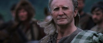 Movie still from “Braveheart” (1995), directed by Mel Gibson – An old man with a long gray hair and a beard; Close Up shot, Low angle