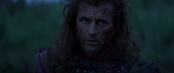 Movie still from “Braveheart” (1995), directed by Mel Gibson – A person wearing a costume; Close Up shot, Low angle