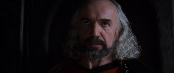 Movie still from “Braveheart” (1995), directed by Mel Gibson – An older man with long white hair and a beard; Close Up shot, Over the shoulder angle