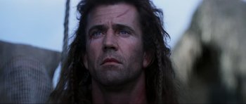 Movie still from “Braveheart” (1995), directed by Mel Gibson – A person with long hair; Close Up shot, Low angle