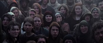 Movie still from “Braveheart” (1995), directed by Mel Gibson – A group of people standing in the middle of a crowd; Medium shot, High angle