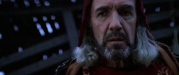 Movie still from “Braveheart” (1995), directed by Mel Gibson – A man with a long beard and a red cape; Close Up shot, Low angle