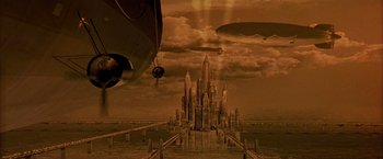 Movie still from “The Patriot” (2000), directed by Roland Emmerich – An artistic rendering of a city with a sky full of clouds; Extreme Wide shot, High angle