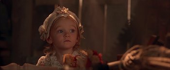 Movie still from “The Patriot” (2000), directed by Roland Emmerich – A little girl wearing a dress and a hat; Close Up shot, Over the shoulder angle
