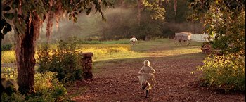 Movie still from “The Patriot” (2000), directed by Roland Emmerich – Two people are running in the dirt; Extreme Wide shot, High angle
