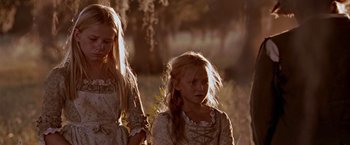 Movie still from “The Patriot” (2000), directed by Roland Emmerich – Two young girls are dressed in medieval clothing; Close Up shot, Low angle