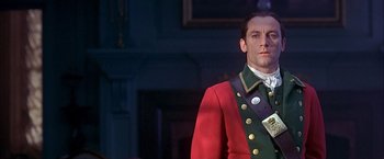 Movie still from “The Patriot” (2000), directed by Roland Emmerich – A person wearing a suit and tie; Close Up shot, Low angle