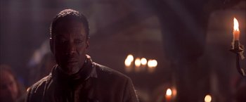 Movie still from “The Patriot” (2000), directed by Roland Emmerich – A person wearing a suit and tie; Close Up shot, Low angle