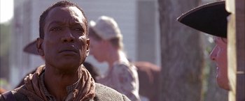 Movie still from “The Patriot” (2000), directed by Roland Emmerich – A person wearing a hat; Close Up shot, Low angle