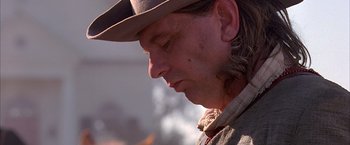 Movie still from “The Patriot” (2000), directed by Roland Emmerich – A person wearing a hat; Close Up shot, Over the shoulder angle