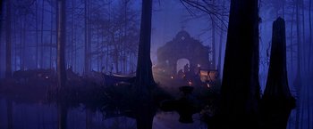 Movie still from “The Patriot” (2000), directed by Roland Emmerich – A group of people standing in the middle of a forest; Extreme Wide shot, Low angle