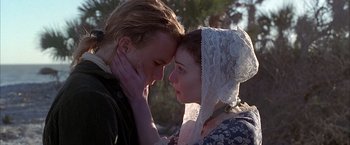 Movie still from “The Patriot” (2000), directed by Roland Emmerich – A man and a woman are looking into each others eyes; Close Up shot, Low angle