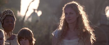 Movie still from “The Patriot” (2000), directed by Roland Emmerich – A beautiful young lady wearing a white dress; Close Up shot, Over the shoulder angle