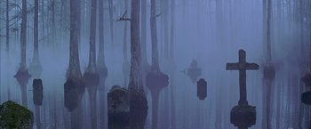 Movie still from “The Patriot” (2000), directed by Roland Emmerich – A person in a canoe in a lake surrounded by trees in the fog; Extreme Wide shot, Low angle