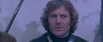 Movie still from “The Patriot” (2000), directed by Roland Emmerich – A person with long hair; Close Up shot, Low angle