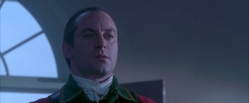 Movie still from “The Patriot” (2000), directed by Roland Emmerich – A person wearing a suit and tie; Close Up shot, Low angle