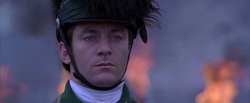 Movie still from “The Patriot” (2000), directed by Roland Emmerich – A person wearing a helmet; Close Up shot, Over the shoulder angle