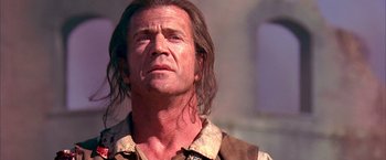 Movie still from “The Patriot” (2000), directed by Roland Emmerich – A person with long hair; Close Up shot, Low angle